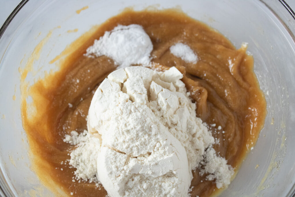 Adding flour, baking powder, and salt