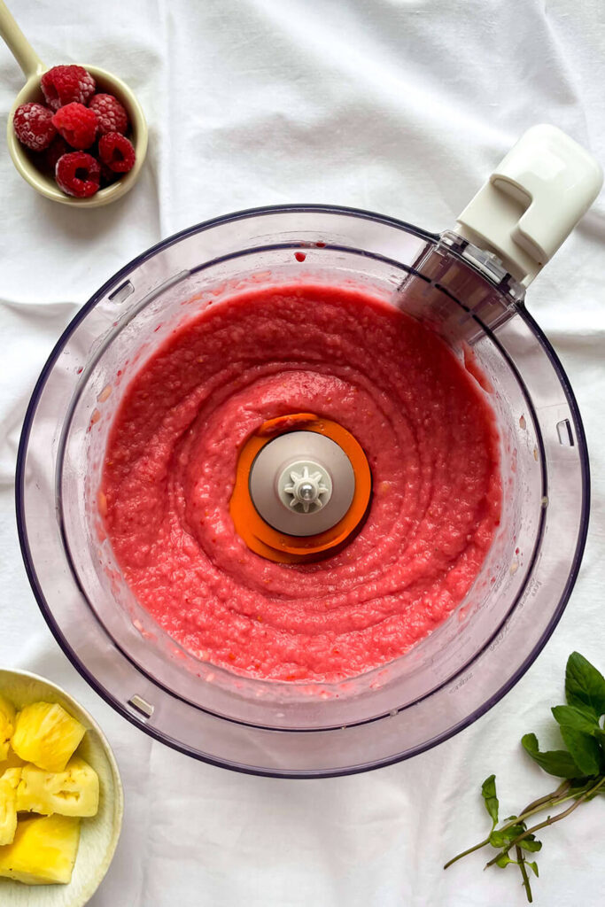 Blending fruits with milk and vanilla