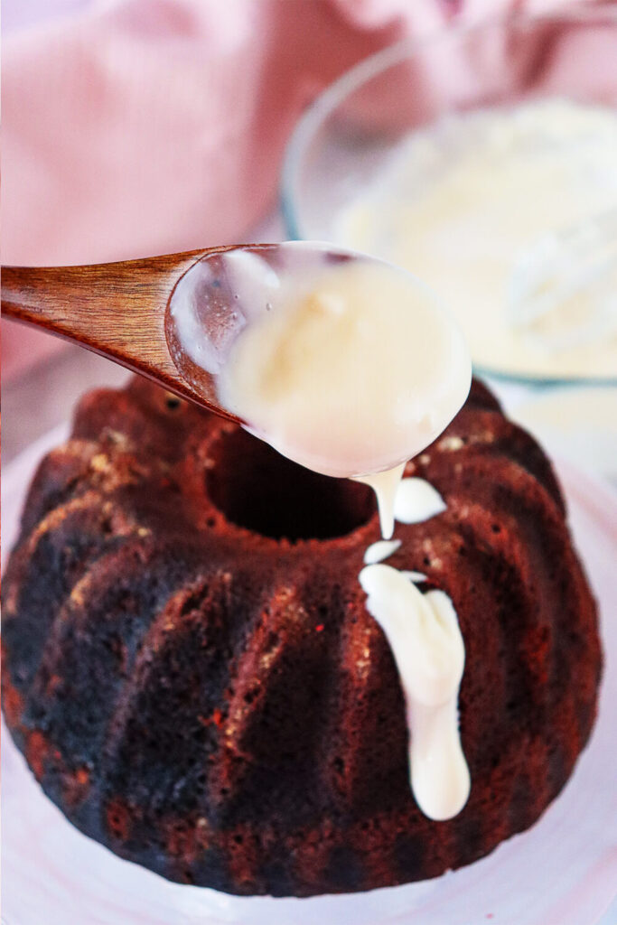 Spreading frosting over the cake