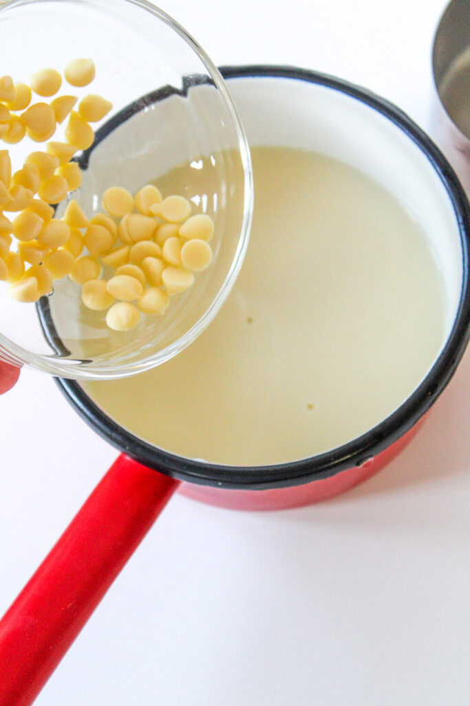 Adding the white chocolate chips