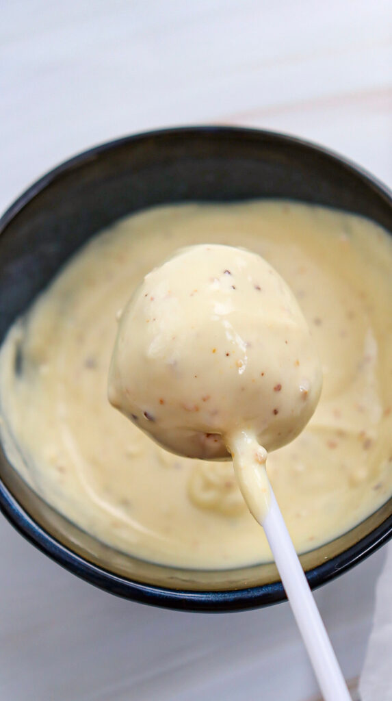 Dipping a cake pop into the cocolate